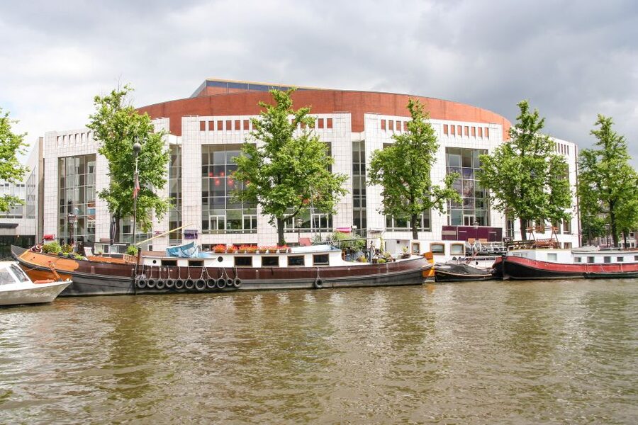Amsterdam Walking Tour and Canal Cruise - A street market and time for everyday Amsterdam