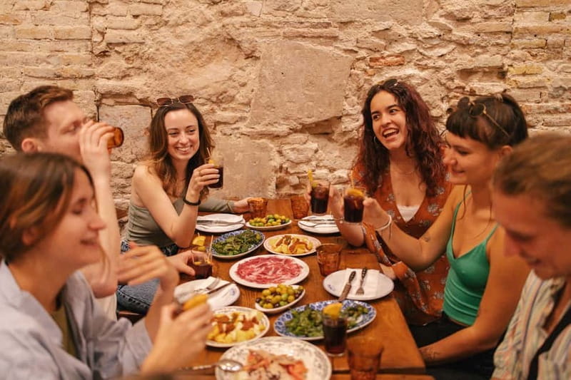 Barcelona: Food Walking Tour with Tapas and Wine - First tastes: bravas, croquettes, and peppers