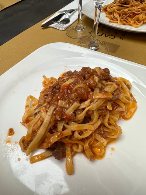 Bologna: Walking Food Tour and Highlights with a Local Guide - Via Drapperie and Bologna’s market character