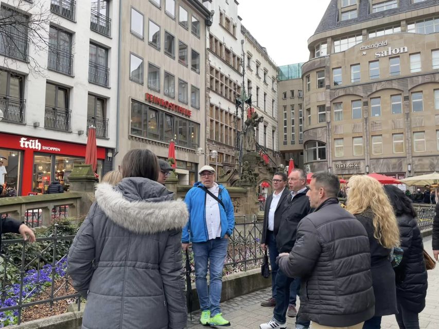 Cologne: 3 Old Town Breweries Guided Walking Tour - Meeting the guide at Heinzelmännchenbrunnen