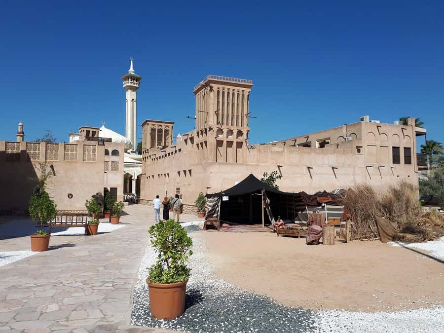 Dubai: Old City Walking Tour with Abra Ride - The old textile market and the walk toward the creek
