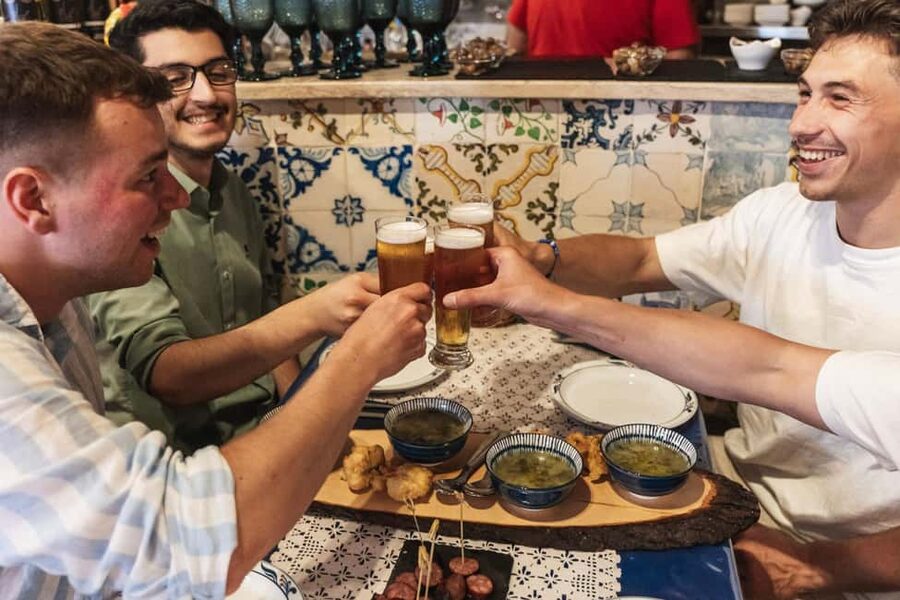 Eat & Walk Through Lisbon: A Local Food & Wine Experience - Rua da Madalena and the neighborhood table