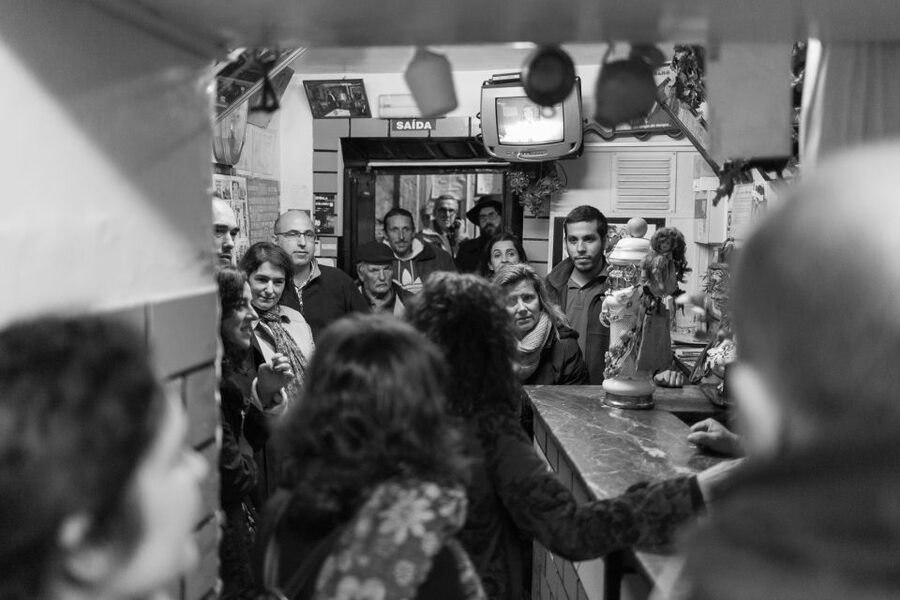 Fado: Musical Walking Tour with Food & Live Show - Hearing a singer in the streets