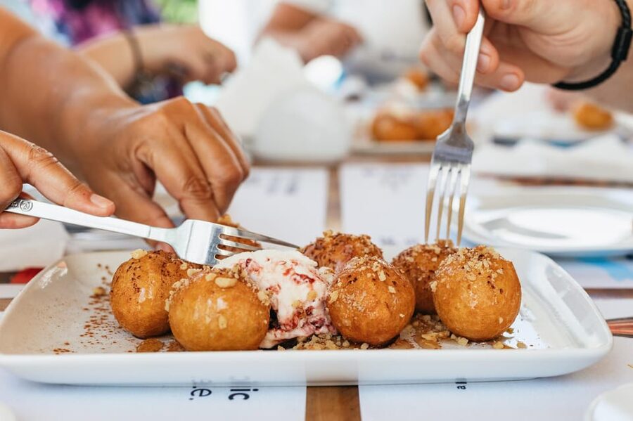 Fira: Guided Foodie Walking Tour with Tastings - From local mezes to the Santorini food story