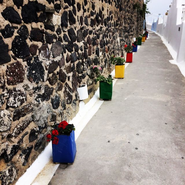 Fira: Guided Foodie Walking Tour with Tastings - Eating at taverns, market stalls, and everyday spots