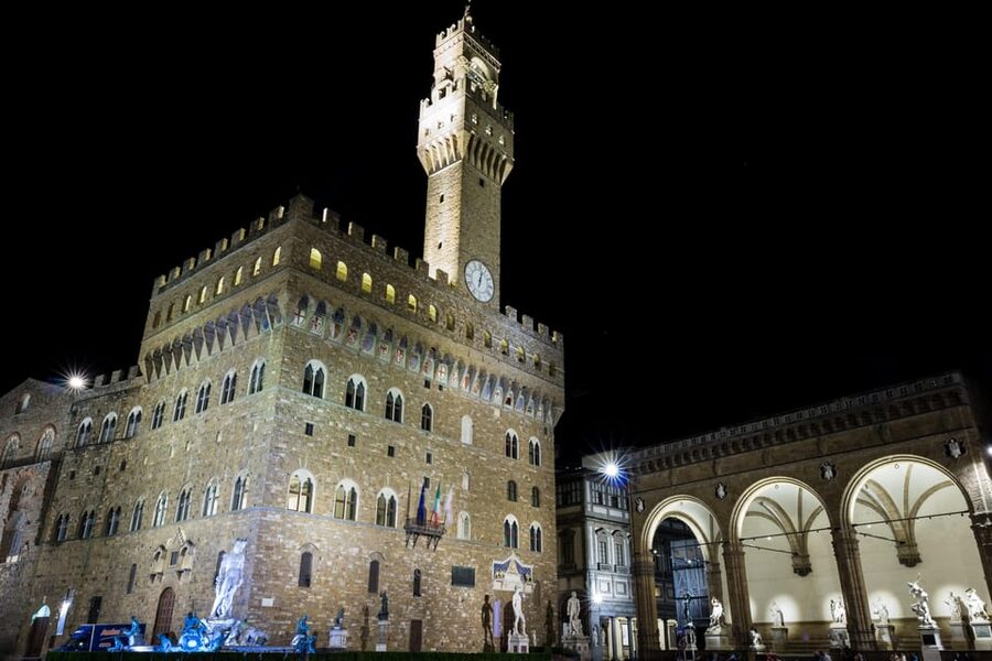 Florence: Dark Secrets & Scandals Evening Walking Tour - Crossing Ponte Vecchio after dark