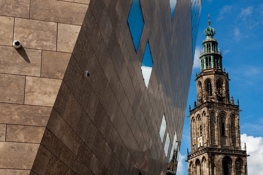 Groningen: Walking Tour with Local Guide - Renaissance details beside modern Groningen