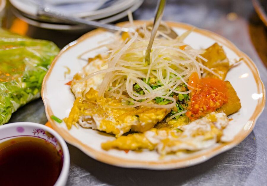 Ho Chi Minh City: Private Street Food Evening Walking Tour - Saigon baguette and the old apartments of District 3
