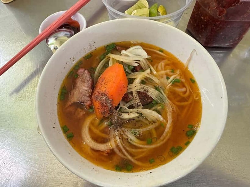 Ho Chi Minh: Original Walking Street Food Tour with Foodies - The first food run: bánh cuốn, bò kho, and grilled beef