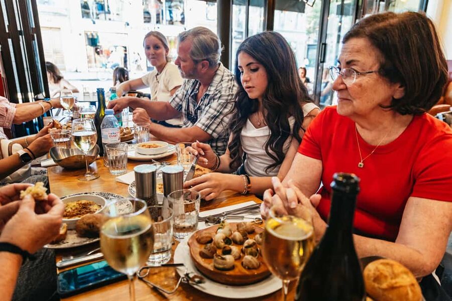 Le Marais Walking Food Tour with Cheese, Wine & Pastries - A restaurant stop with wine and local specialties