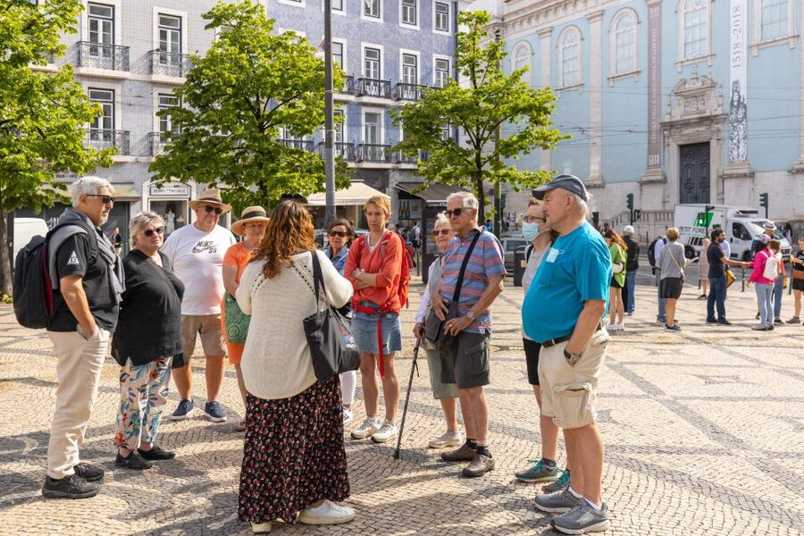 Lisbon: History, Stories and Lifestyle Walking Tour - The tram ride turns sightseeing into city life