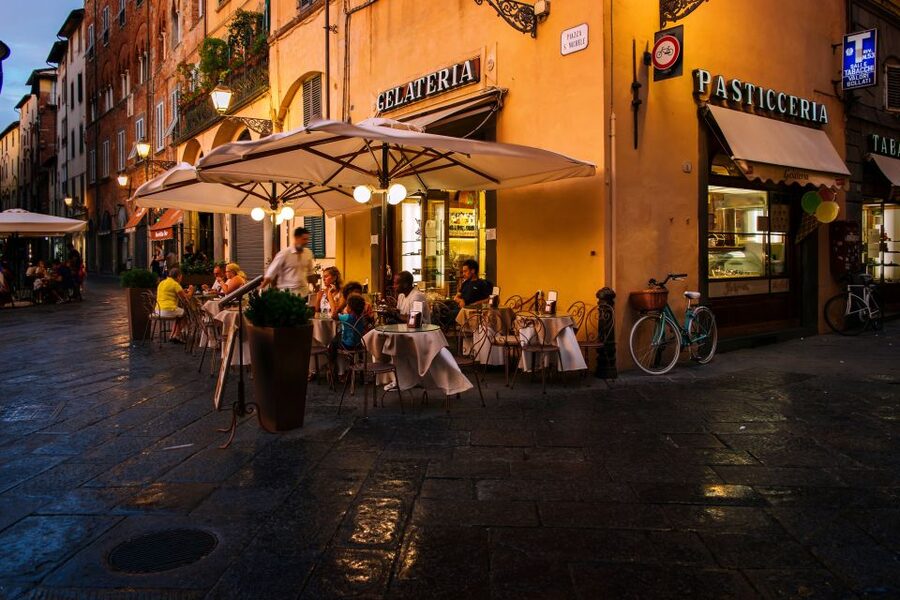 Lucca: Guided Food Walking Tour with Tastings - The first stop: wine, cheese, and local bites