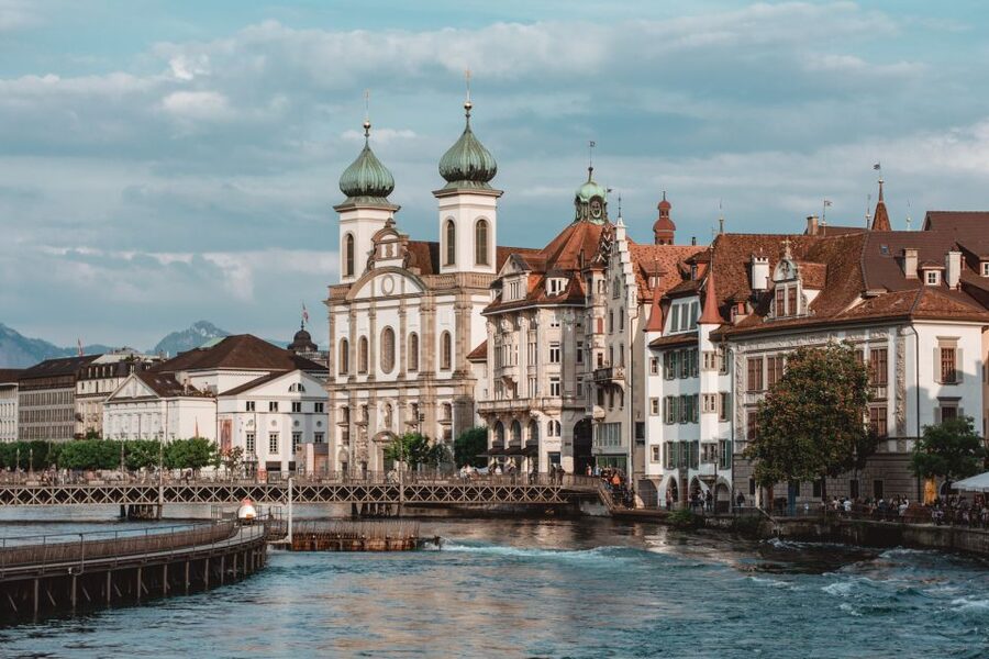 Lucerne: Guided Walking Tour with an Official Guide - Old-town squares, churches, and painted facades