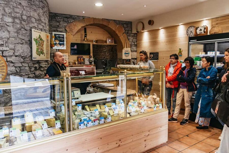 Lyon: Vieux Lyon Food Tasting Walking Tour - Stop three: meats, savory specialties, and local habits