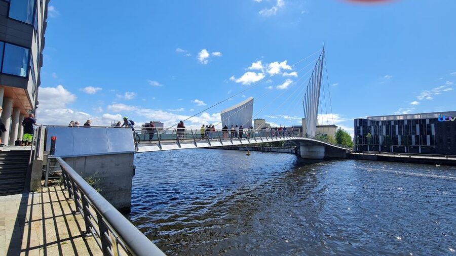 Manchester: Media City & The Quays Guided Walking Tour - Crossing bridges beside the Manchester Ship Canal