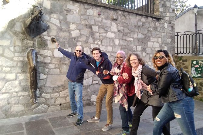 Montmartre Hidden Gems and Scenic Highlights Walking Tour - A man walking through a wall