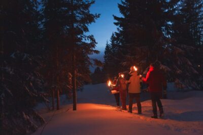 Snowy Forest Torchlight Walk with Campfire
