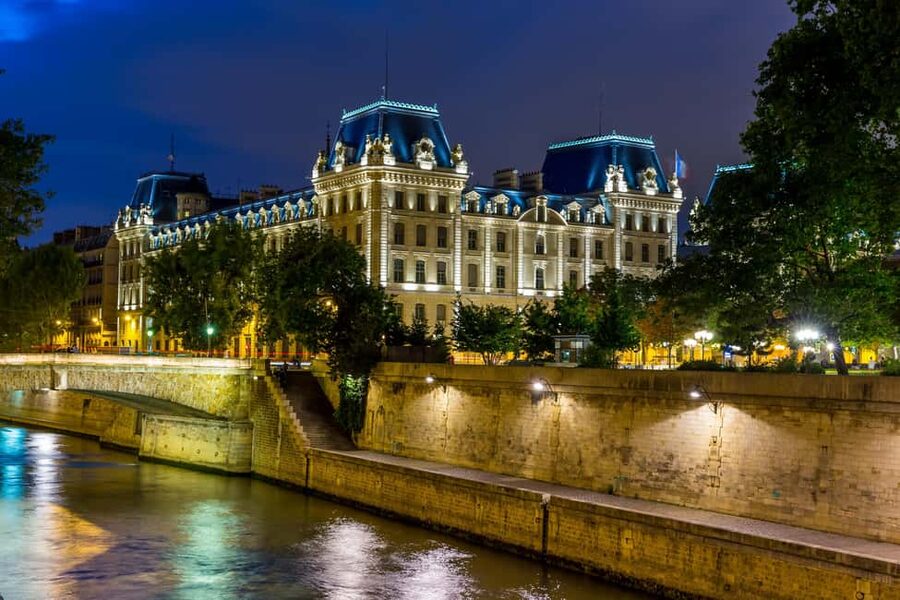 Paris: Ghosts, Legends & Mysteries Evening Walking Tour - Passing the Louvre after dark