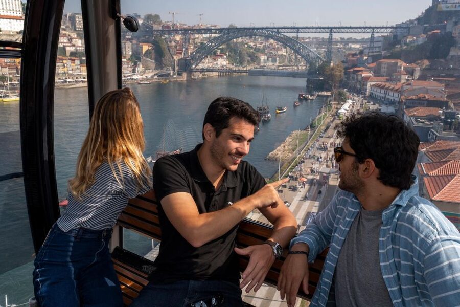 Porto: Walking Tour, Lello Bookshop, Boat and Cable Car - Crossing toward the Dom Luís I Bridge