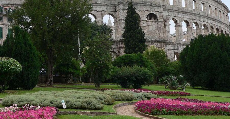 Pula: Historic Walking Tour with Local Guide & City Views - Looking beyond gladiators at the Arena