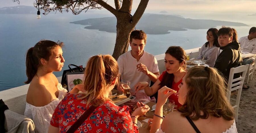 Santorini: Sunset Walking Tour with Local Food and Drinks - First tastes: liqueur, local sweets, and Caldera views