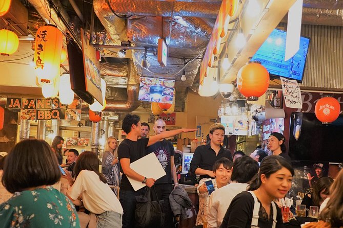 Shibuya Meltdown Nightlife Tour: All-You-Can-Drink Bar Hopping - Walking past Shibuya 109 into Center-gai